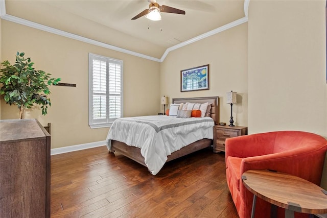 bedroom with ornamental molding, vaulted ceiling, ceiling fan, and dark hardwood / wood-style flooring