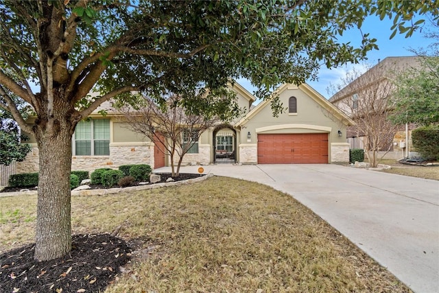 view of front of home with a garage and a front lawn