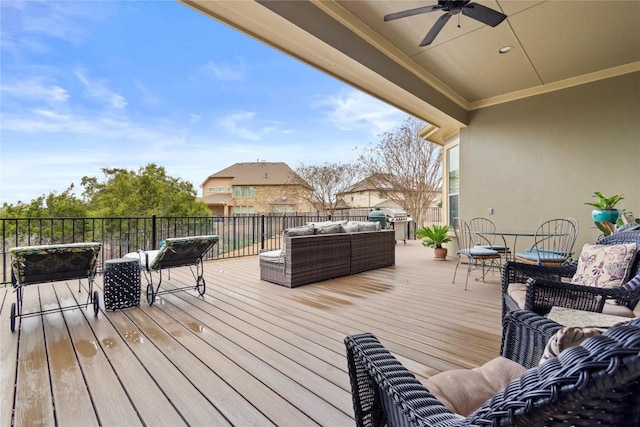 deck featuring ceiling fan and an outdoor living space