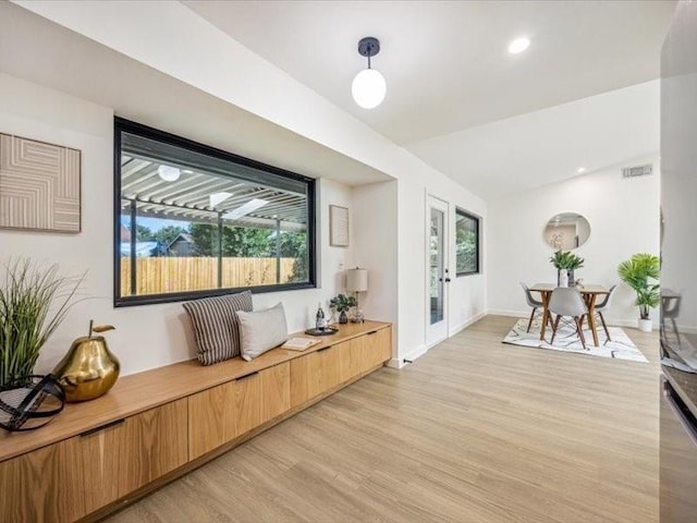 living room with light hardwood / wood-style flooring and french doors