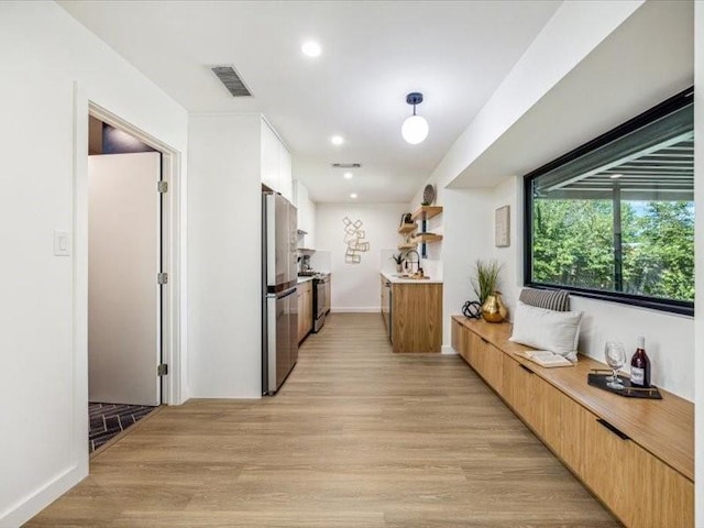 hall featuring light hardwood / wood-style flooring