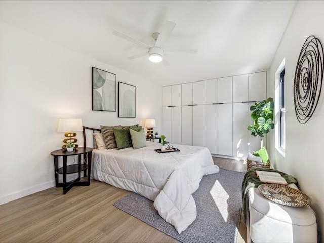 bedroom featuring ceiling fan and light wood-type flooring