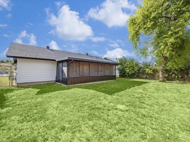 back of house featuring a yard