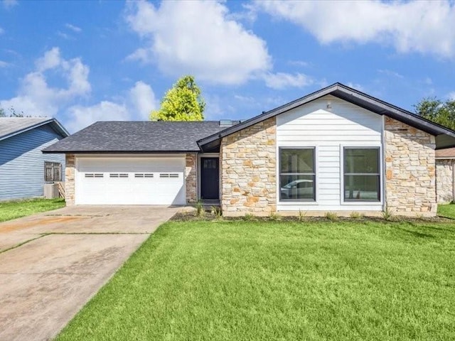 view of front facade with a garage and a front yard