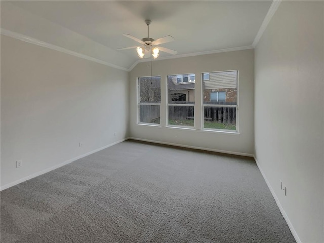 carpeted spare room with crown molding, ceiling fan, and lofted ceiling