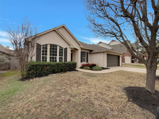 ranch-style home with a garage and a front yard