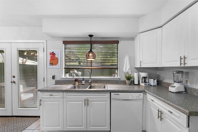 kitchen featuring pendant lighting, sink, white cabinetry, white dishwasher, and french doors