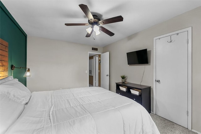 carpeted bedroom with ceiling fan