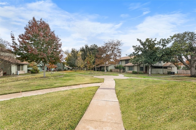 view of home's community featuring a yard