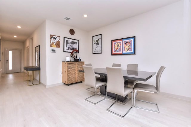 dining area with recessed lighting, light wood-style floors, visible vents, and baseboards