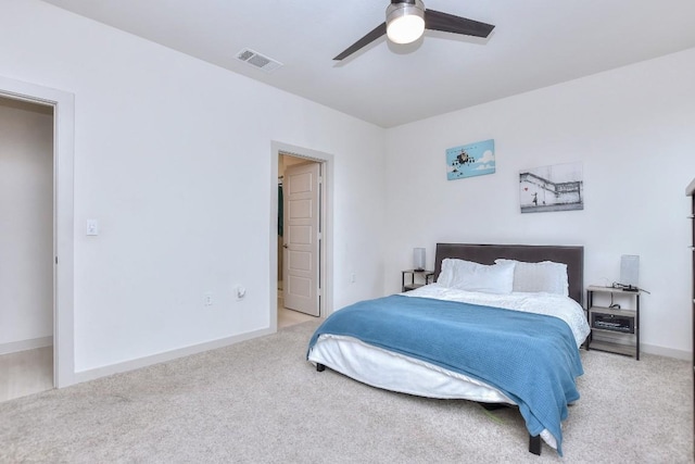 bedroom featuring visible vents, baseboards, light colored carpet, and ceiling fan