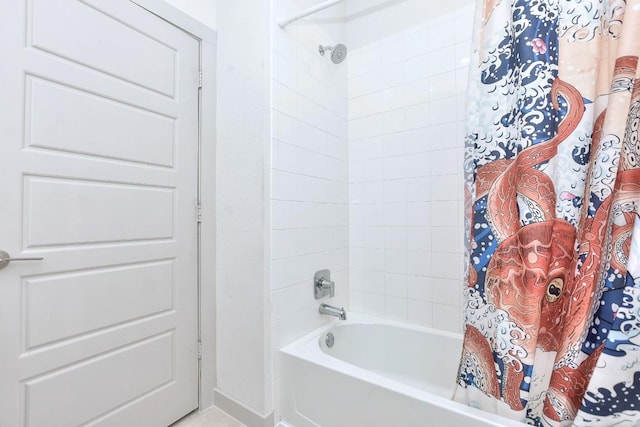 bathroom featuring shower / tub combo with curtain