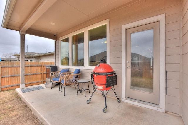 view of patio featuring fence