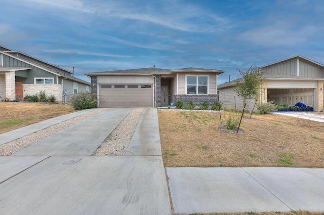 ranch-style home with a garage and a front lawn