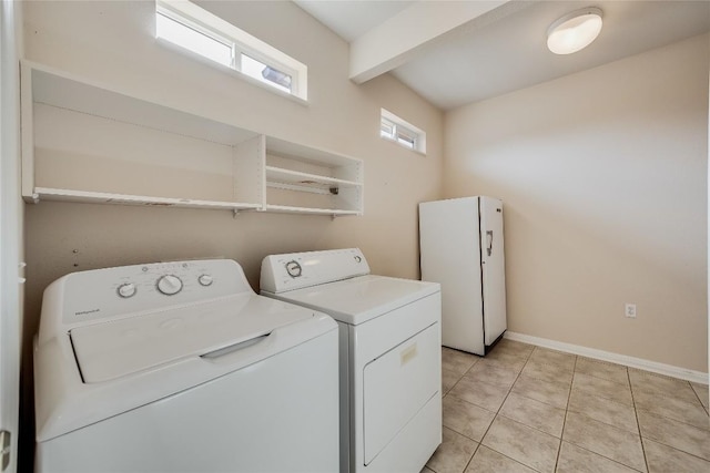 washroom featuring independent washer and dryer and light tile patterned floors