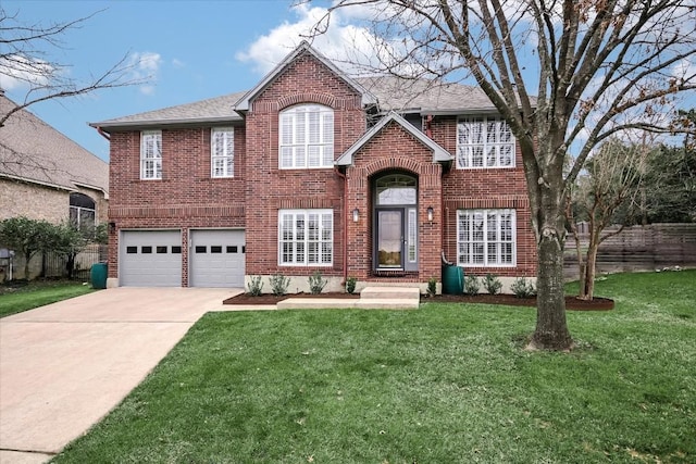 view of front of home featuring a garage and a front yard