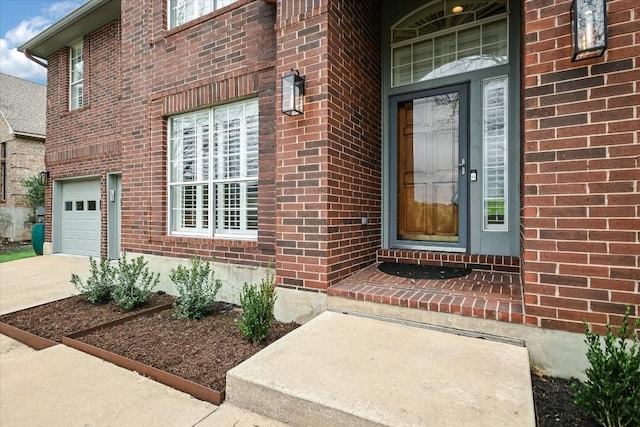 entrance to property featuring a garage