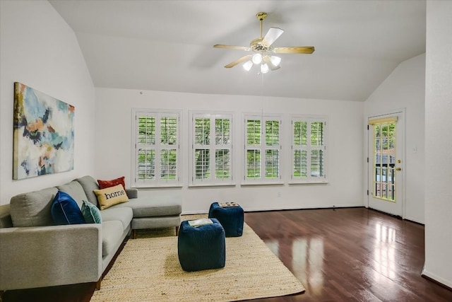 living room with vaulted ceiling, dark hardwood / wood-style floors, a wealth of natural light, and ceiling fan