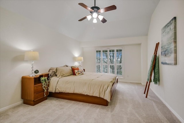 carpeted bedroom with ceiling fan and lofted ceiling