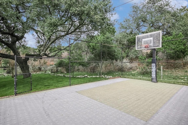 view of basketball court featuring a lawn