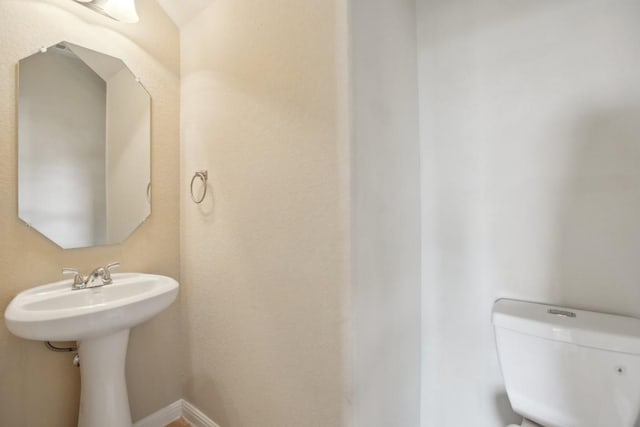 bathroom with sink and toilet