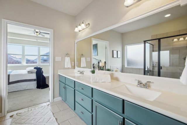 bathroom featuring vanity, an enclosed shower, tile patterned flooring, and plenty of natural light