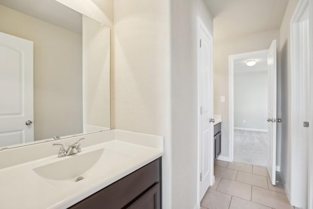 bathroom with vanity and tile patterned flooring