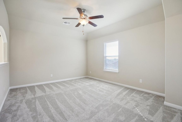 carpeted empty room featuring ceiling fan