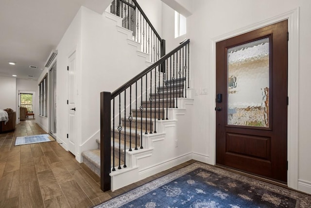 foyer entrance featuring dark hardwood / wood-style flooring