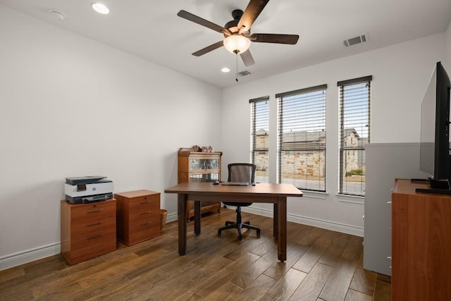 office with dark wood-type flooring, a wealth of natural light, and ceiling fan