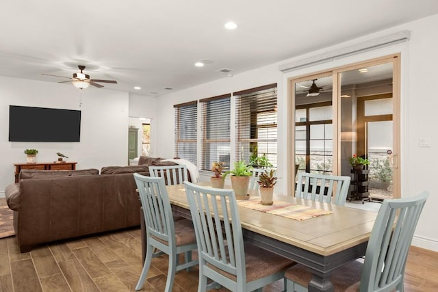 dining room featuring ceiling fan and hardwood / wood-style floors