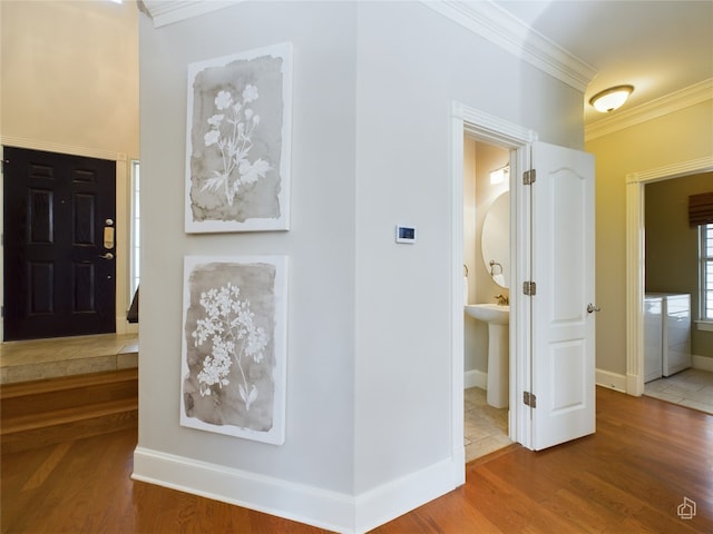 corridor with ornamental molding and wood-type flooring