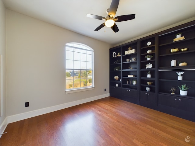 spare room with ceiling fan and hardwood / wood-style floors