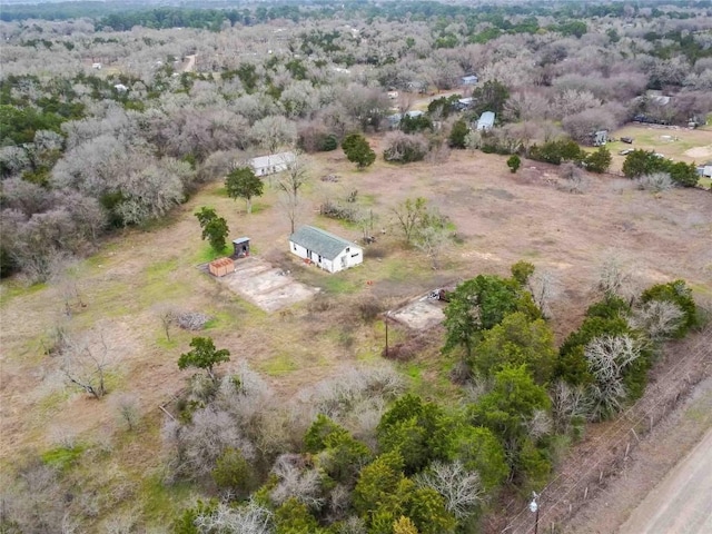 birds eye view of property with a rural view