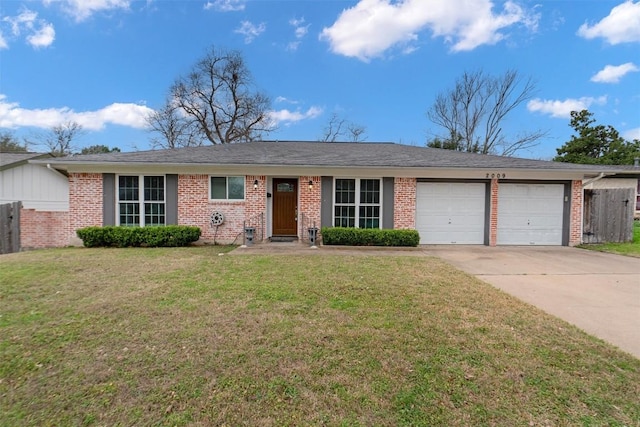 ranch-style home with a garage and a front lawn