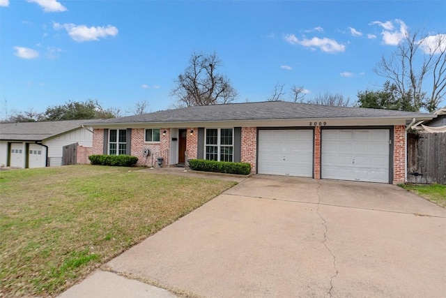 ranch-style house featuring a garage and a front yard