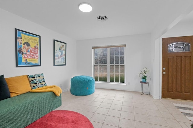 sitting room featuring light tile patterned flooring