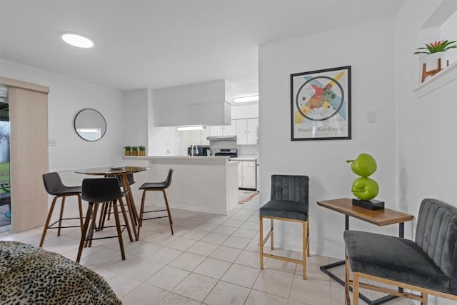 dining area featuring light tile patterned floors