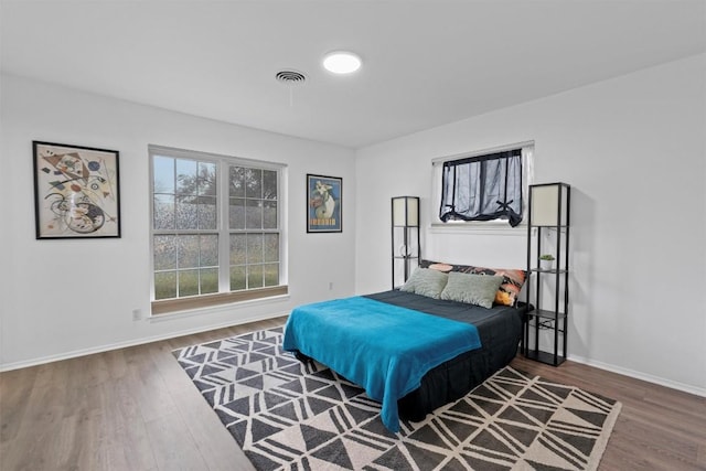 bedroom featuring wood-type flooring