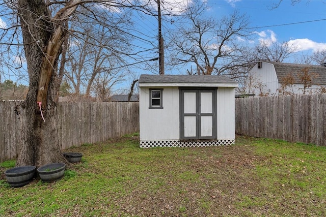 view of outdoor structure featuring a lawn