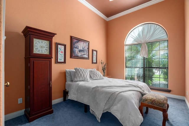 bedroom with crown molding and dark carpet