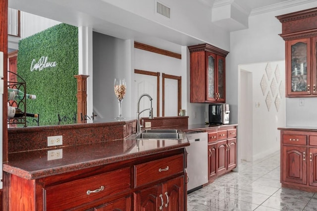 kitchen featuring dark stone countertops, sink, ornamental molding, and dishwasher