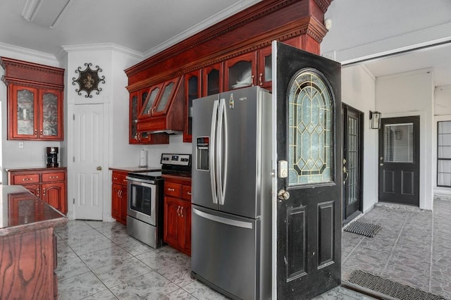 kitchen featuring ornamental molding, stainless steel appliances, and premium range hood