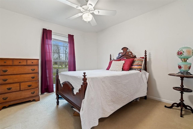 bedroom with light carpet and ceiling fan