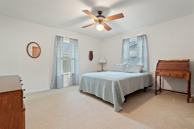 bedroom with light colored carpet and ceiling fan