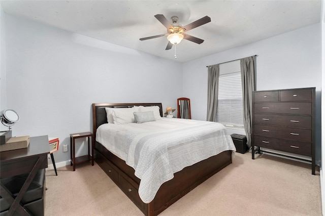 bedroom with light carpet and ceiling fan