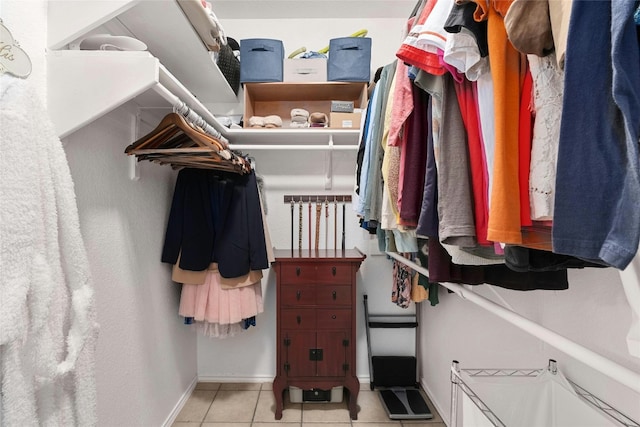 spacious closet featuring light tile patterned floors