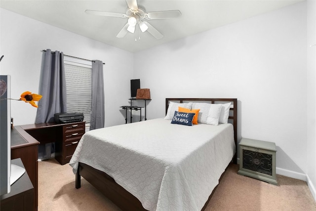 bedroom featuring light colored carpet and ceiling fan