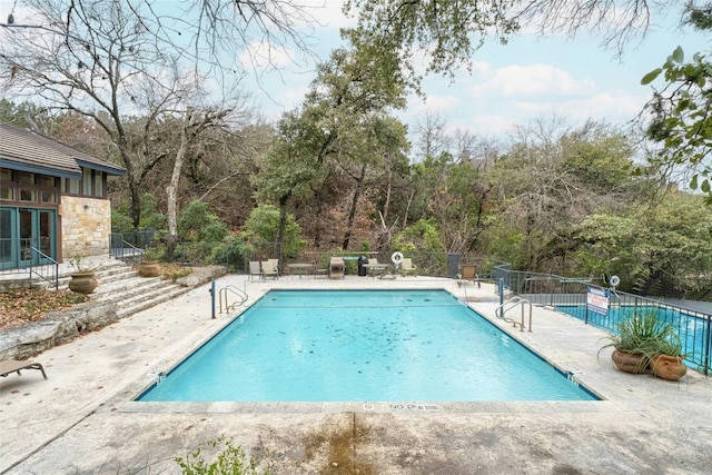 view of swimming pool featuring a patio