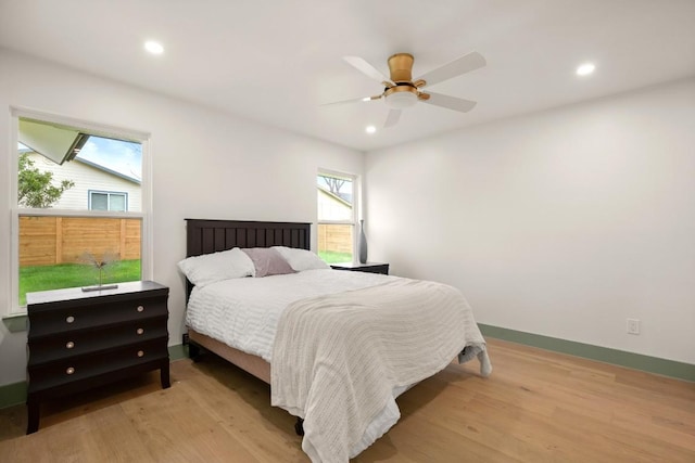 bedroom featuring ceiling fan and light hardwood / wood-style floors